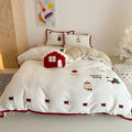 Cartoon winter-themed children's bedding four-piece set with duvet cover, sheet, and pillowcases.