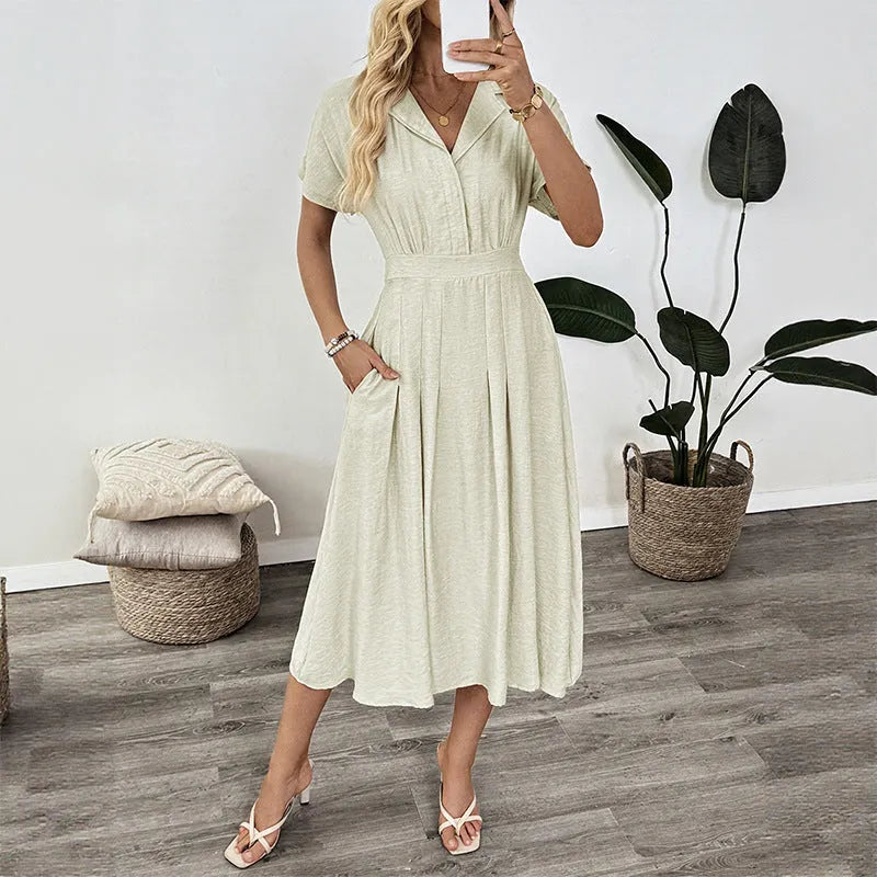 Light green women's twill shirt dress with lapel collar, waist tie, and a pocket.