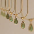 Retro blue and green water drop necklace with mixed gemstone inlays on titanium steel snake bone chain