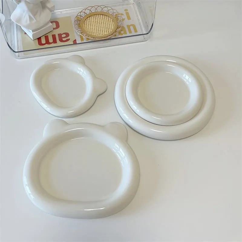 White ceramic plate with bear doodle design, 20cm diameter, on a table.