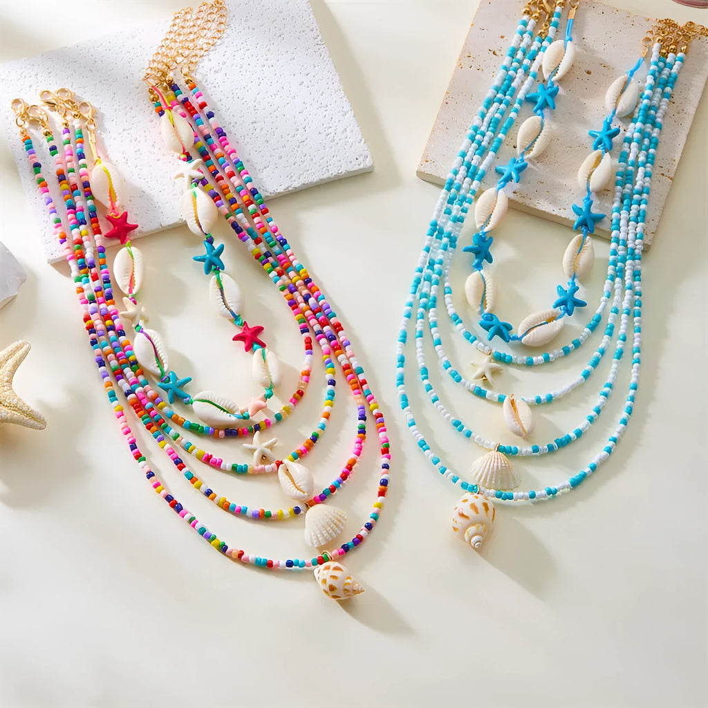Five women's necklaces with starfish, shell and conch bead pendants on adjustable chains