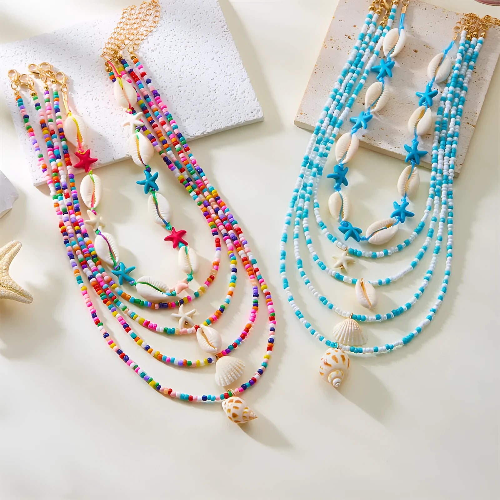 Five women's necklaces with starfish, shell and conch bead pendants on adjustable chains
