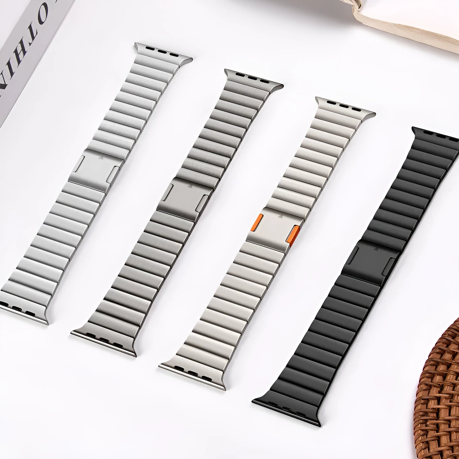 Silver stainless steel Apple Watch strap with magnetic buckle on a wrist