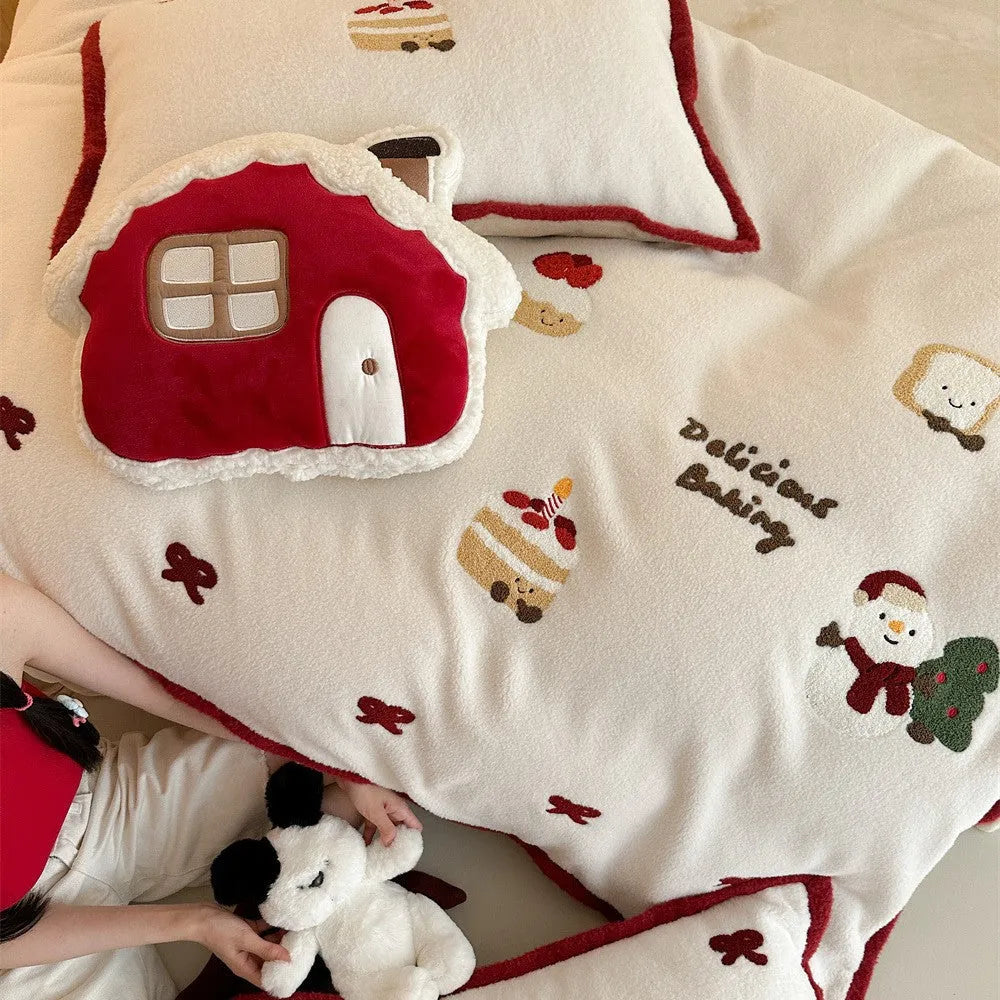 Cartoon winter-themed children's bedding four-piece set with duvet cover, sheet, and pillowcases.