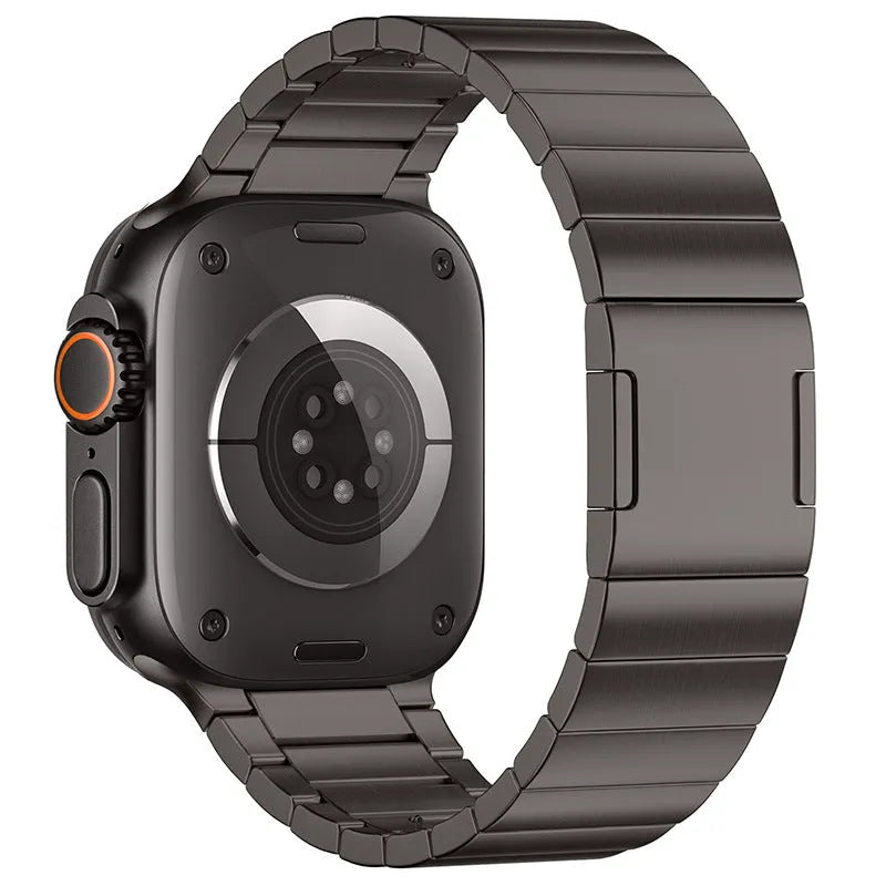 Silver stainless steel Apple Watch strap with magnetic buckle on a wrist