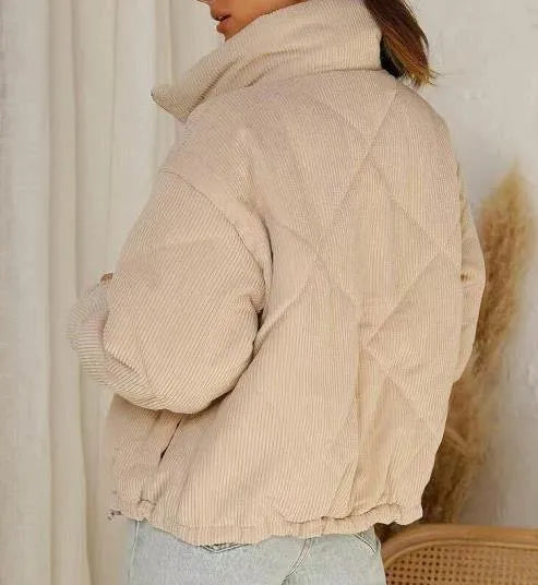 Apricot women's corduroy zip jacket with a stand collar and long sleeves.
