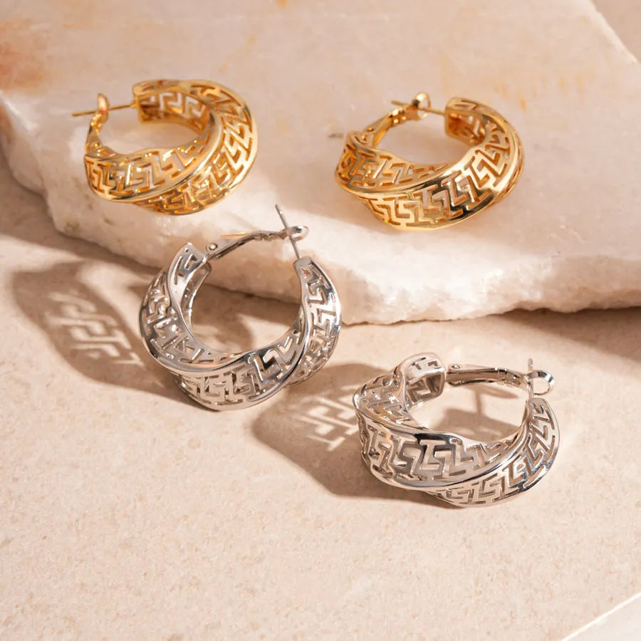Women's twisted geometric hollow stud earrings in gold and silver electroplated finishes