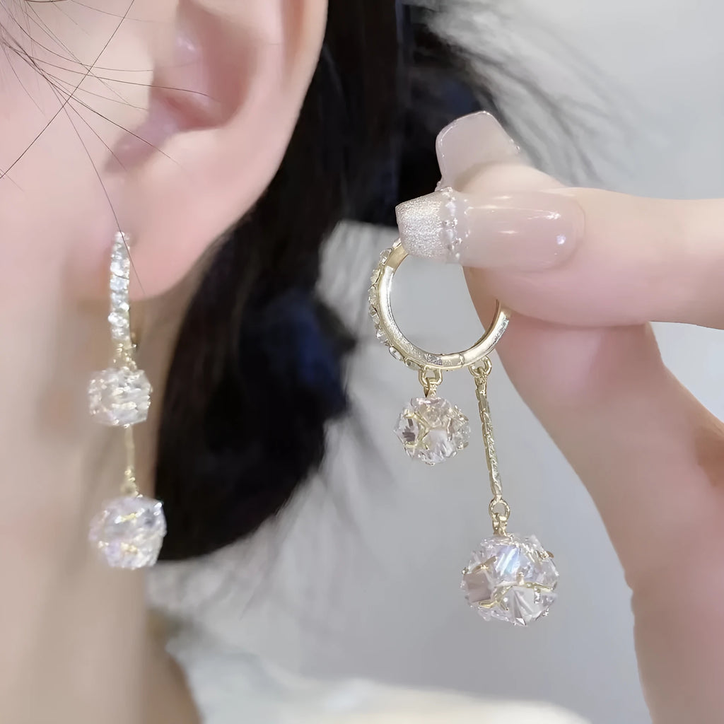 Women's silver drop earrings with confession balloon and rhinestone ball pendants and tassel detailing