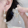 Women's silver drop earrings with confession balloon and rhinestone ball pendants and tassel detailing