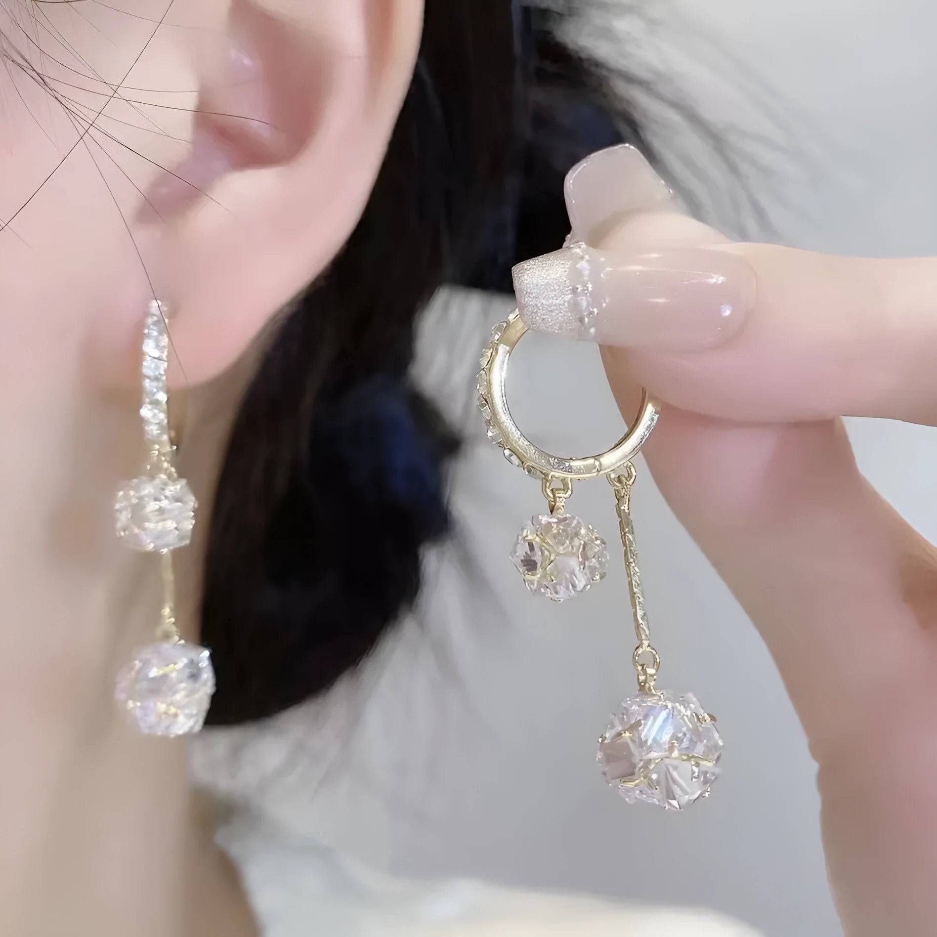 Women's silver drop earrings with confession balloon and rhinestone ball pendants and tassel detailing