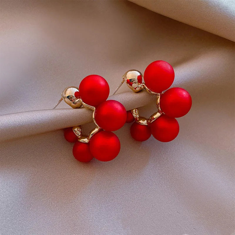 Red alloy drop earrings for women with a hanging bell charm design