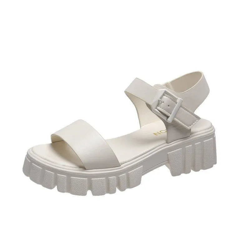 Beige women's platform sandals with peep toe and ankle strap buckle on a white background.