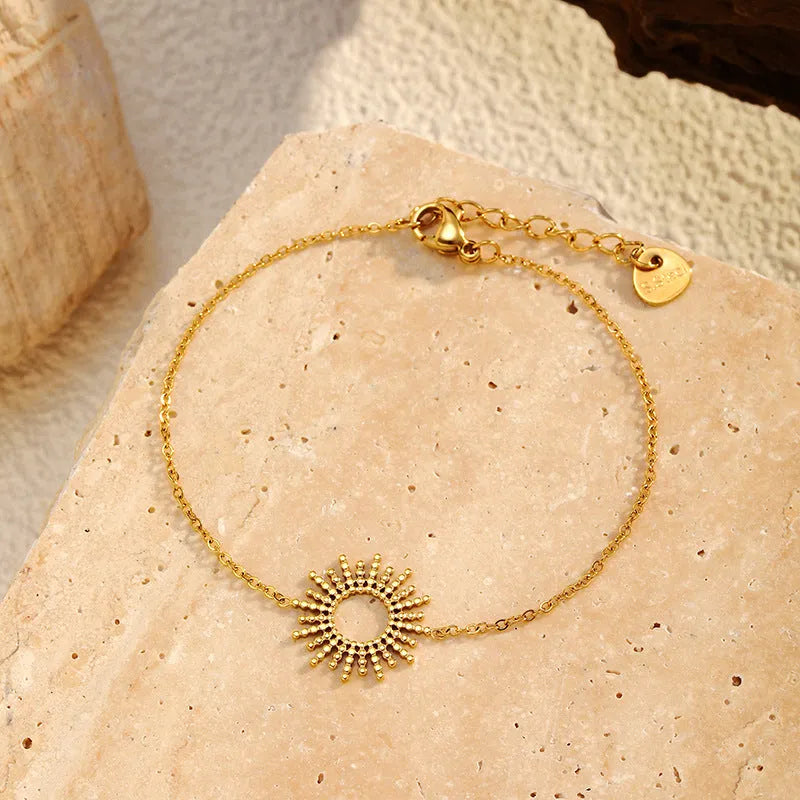 Gold plated stainless steel sunflower necklace and bracelet set with geometric chain design for women