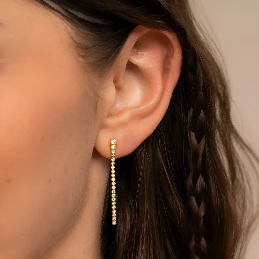 Geometric line design stainless steel earrings with zircon stones in gold and steel colour options.