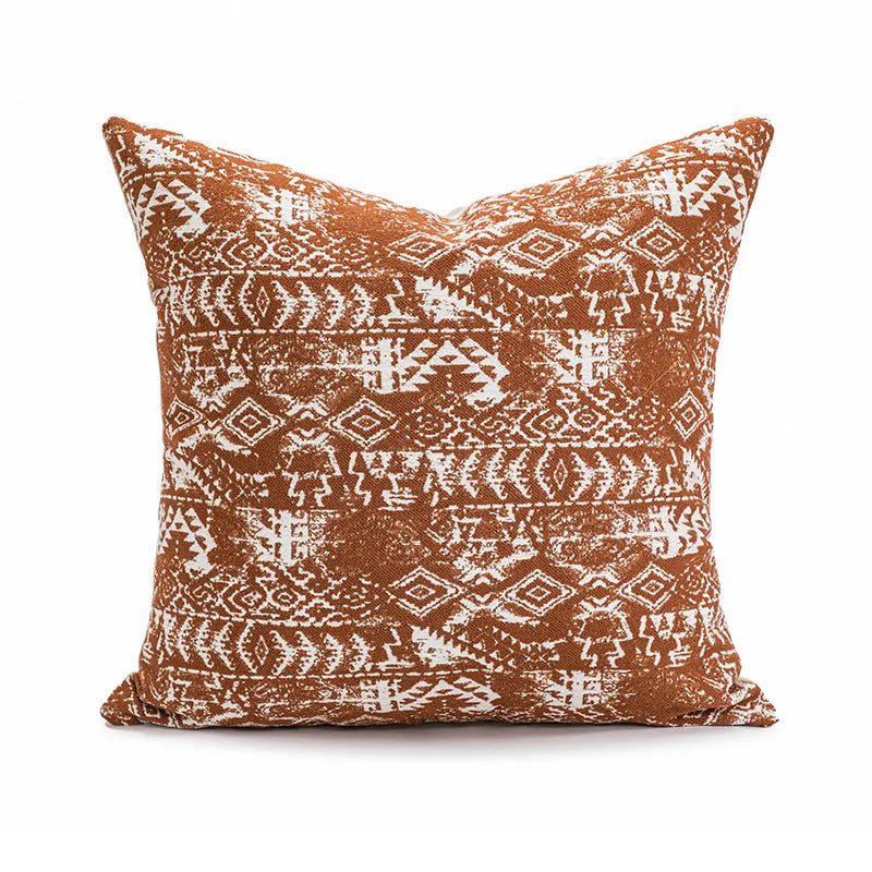 Solid colour decorative pillow cushion in red coffee colour on a living room sofa