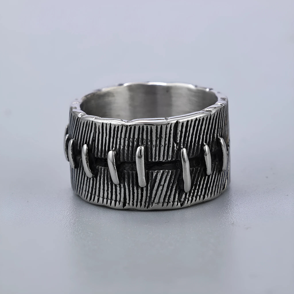 Geometric titanium steel double ring with U-shape design in retro colour on a hand.