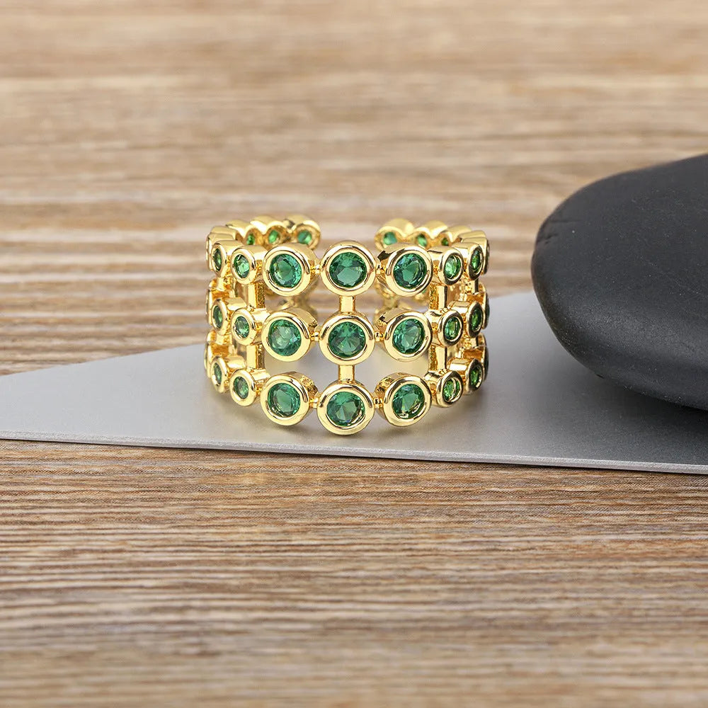 Copper 18K gold plated ring with three-layer green zircon setting in wide band design