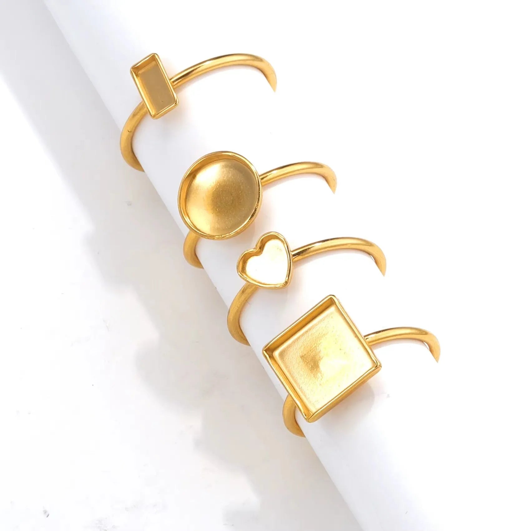Golden electroplated stainless steel ring holder with multiple shape settings for jewellery display