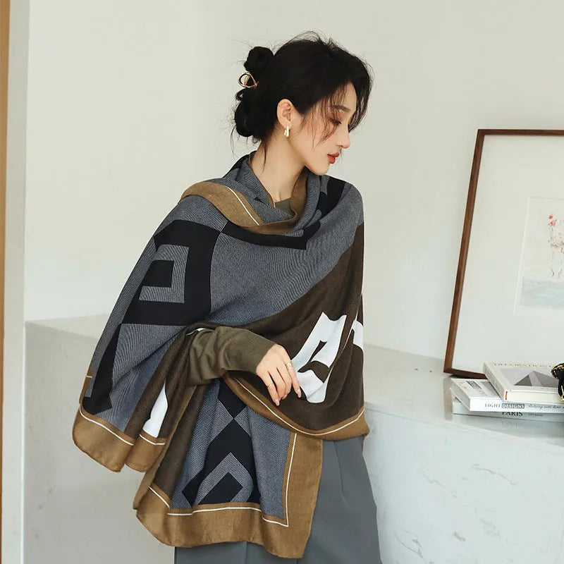 A woman wearing a printed polyester shawl measuring 180cm by 90cm.