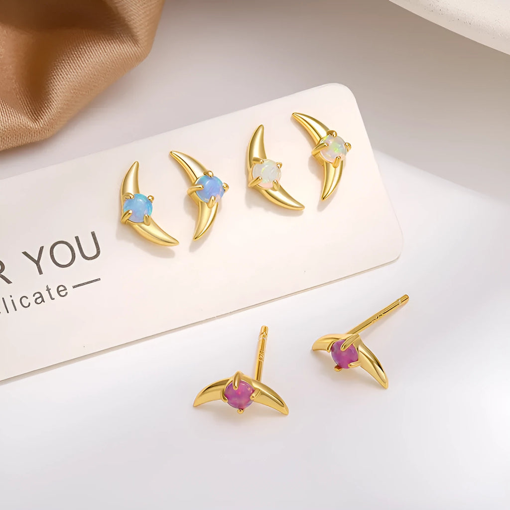 Geometric women's earrings in 925 silver with gold plating and a blue cubic zirconia stone.