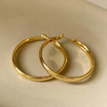 40mm circular metal earrings with electroplated gold or silver finish on copper base