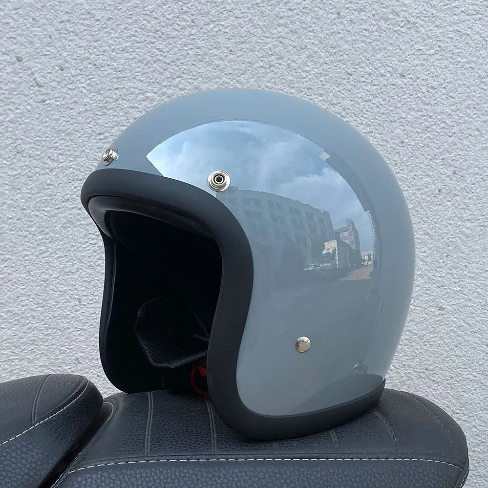 Glass fibre motorcycle half helmet shown in a retro style on a stand.