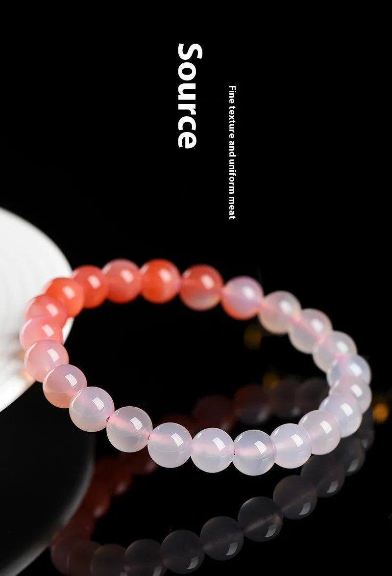 Natural gradient Yanyuan agate bracelet with geometry-cut beads on a wrist, showing salt source colour variation.