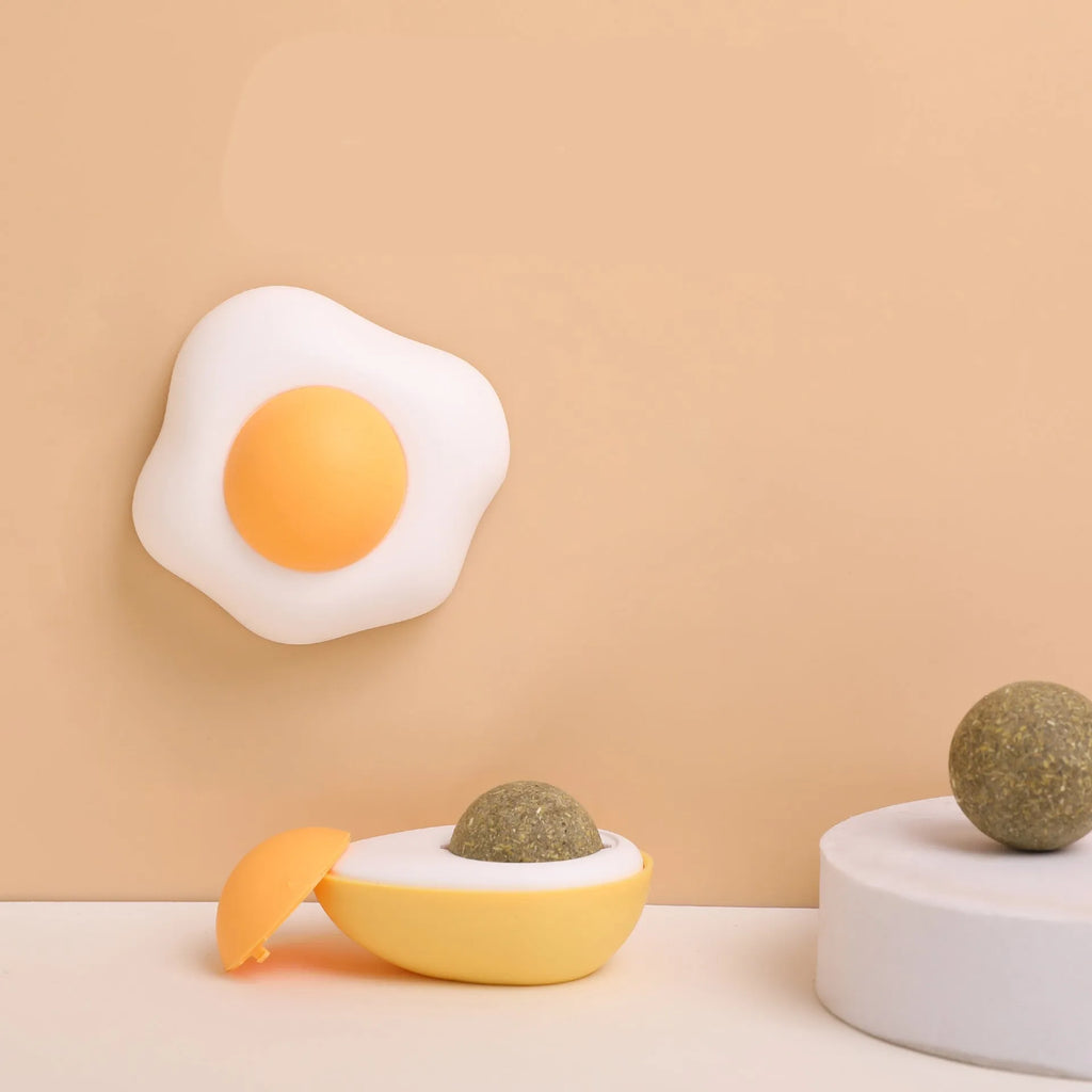 Organic catnip ball toy in egg shape with wall mounting for feline dental care and interactive play