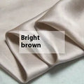 Silk duvet cover in lotus pink colour showing double-sided construction and plain weave texture