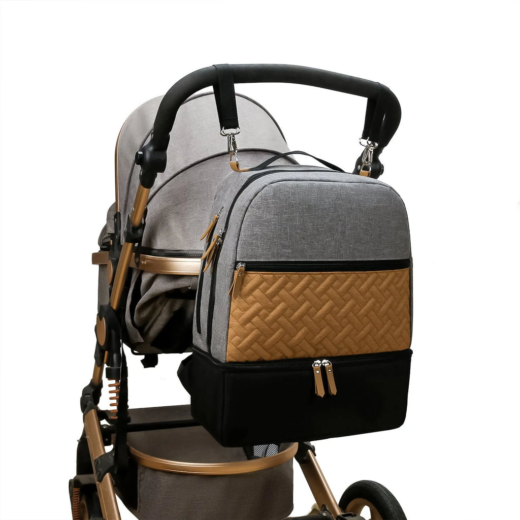 Grey insulated mother and child travel mummy backpack with curved shoulder straps and multiple compartments