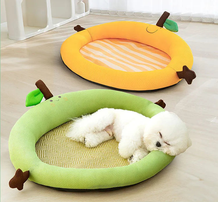 Green large pet bed nest with a raised fruit-shaped backrest for dogs on a wooden floor.