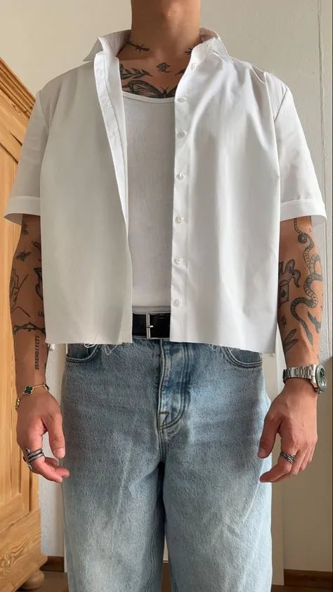 White men's cropped short sleeve polyester shirt on a hanger, plain design.