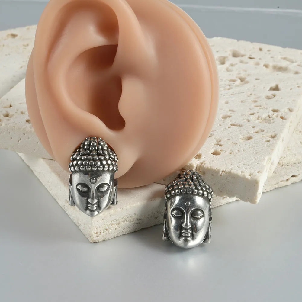 Stainless steel hollow skull Buddha earrings with geometric design and electroplated colour finishes