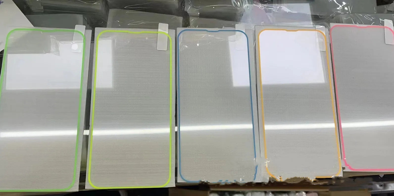 Fluorescent tempered glass screen protector for iPhone in luminous pink, yellow, green, blue and grass green colours