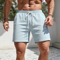 Men's straight-leg loose fit polyester track shorts shown in solid colours: black, white, navy blue, light blue, and khaki.