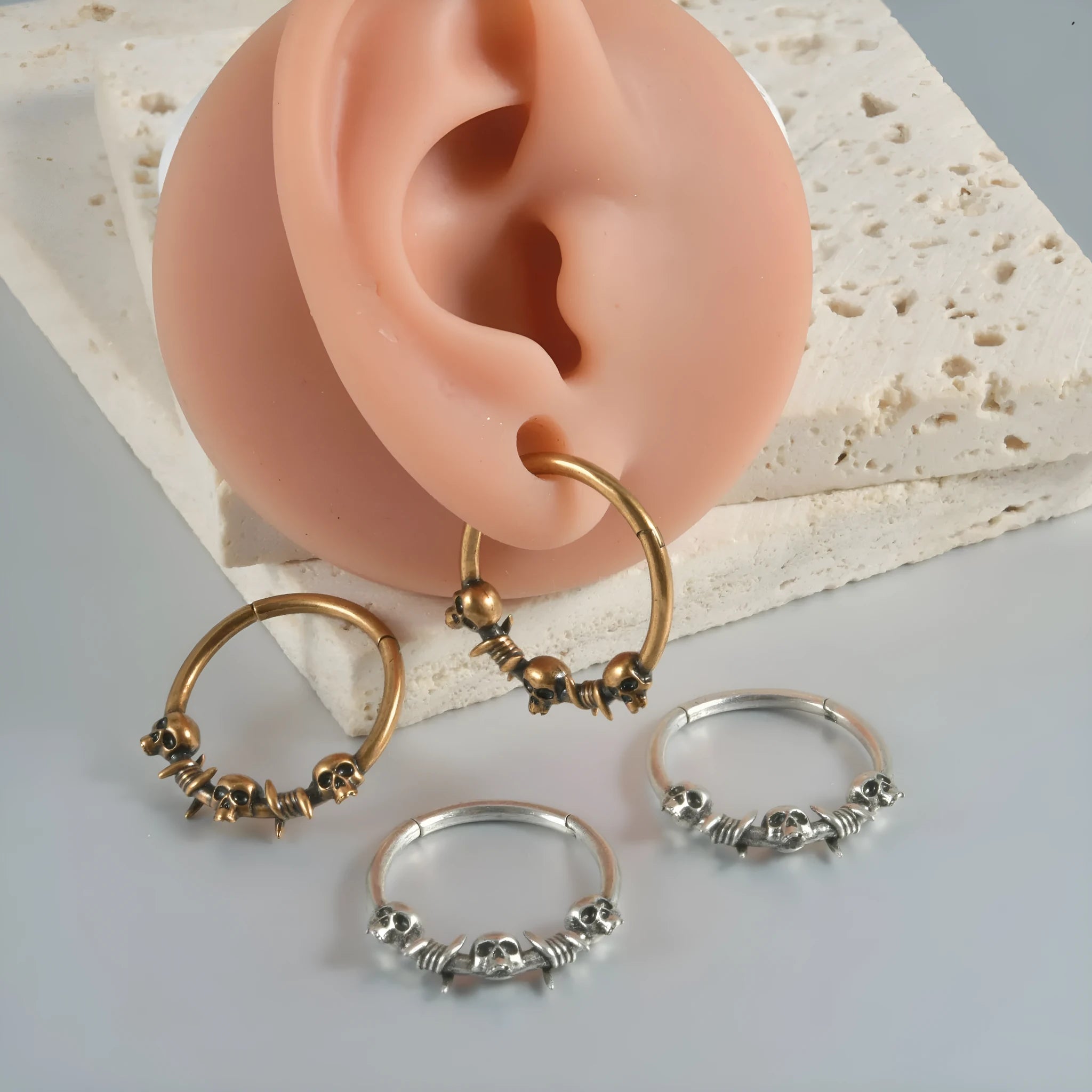 Copper punk earrings with ghost head motifs in antique gold or silver finish
