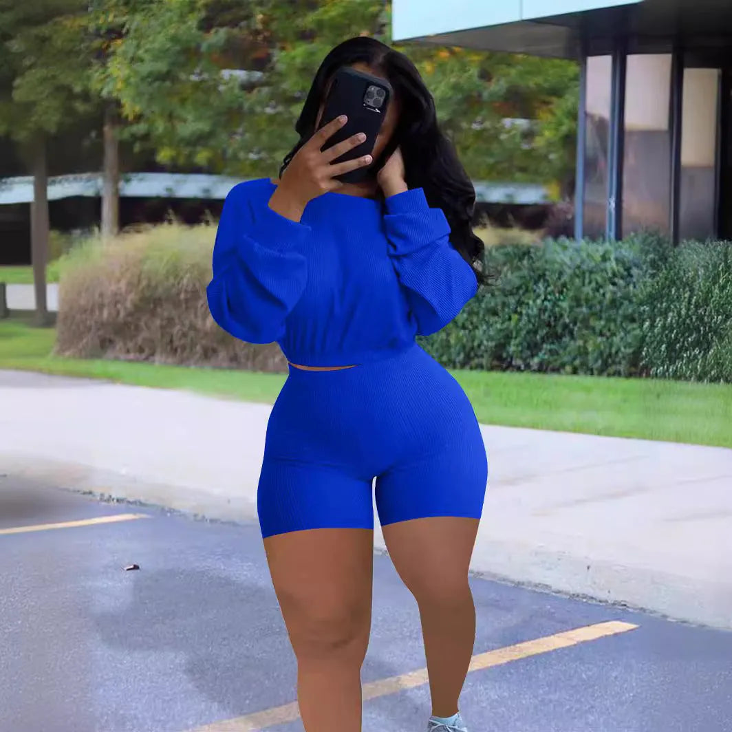 Women's sunken stripe off-the-shoulder long sleeve top and shorts two-piece set in a solid colour.