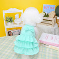 Small dog wearing polyester princess dress with layered candy skirt in rose red colour
