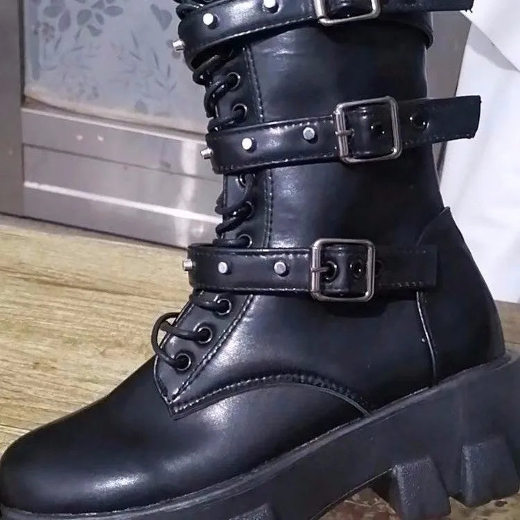 Women's black mid-calf boots with side zip and metal buckle detail on a white background.
