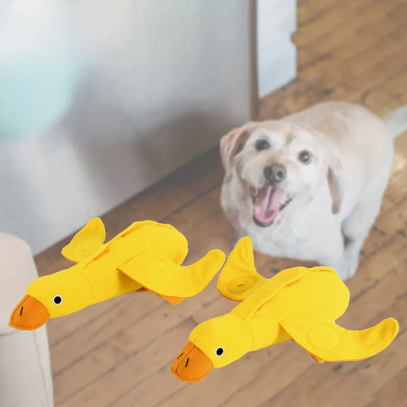Yellow dog training toy with duck sound module and central treat dispenser slot