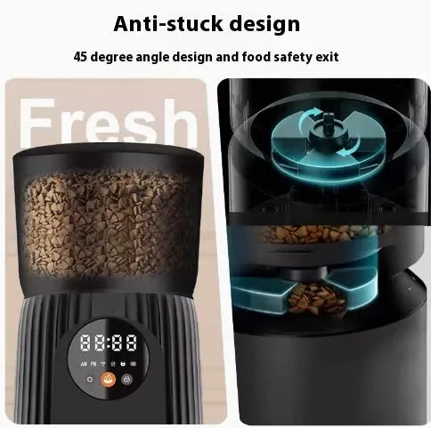 Black automatic pet feeder with digital display and food hopper on a countertop.