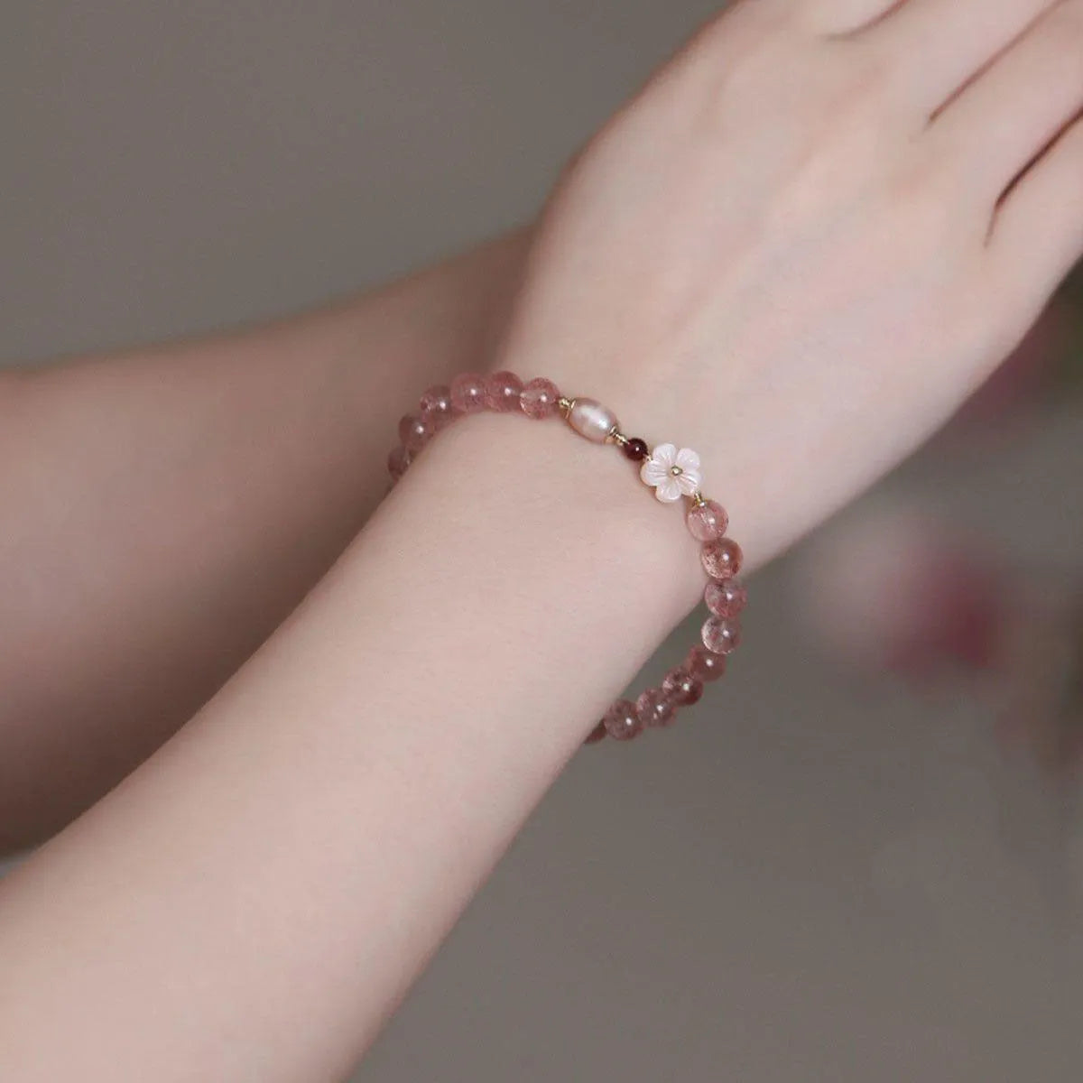 Strawberry quartz peach blossom bracelet with natural pink crystal flower beads for casual wear.