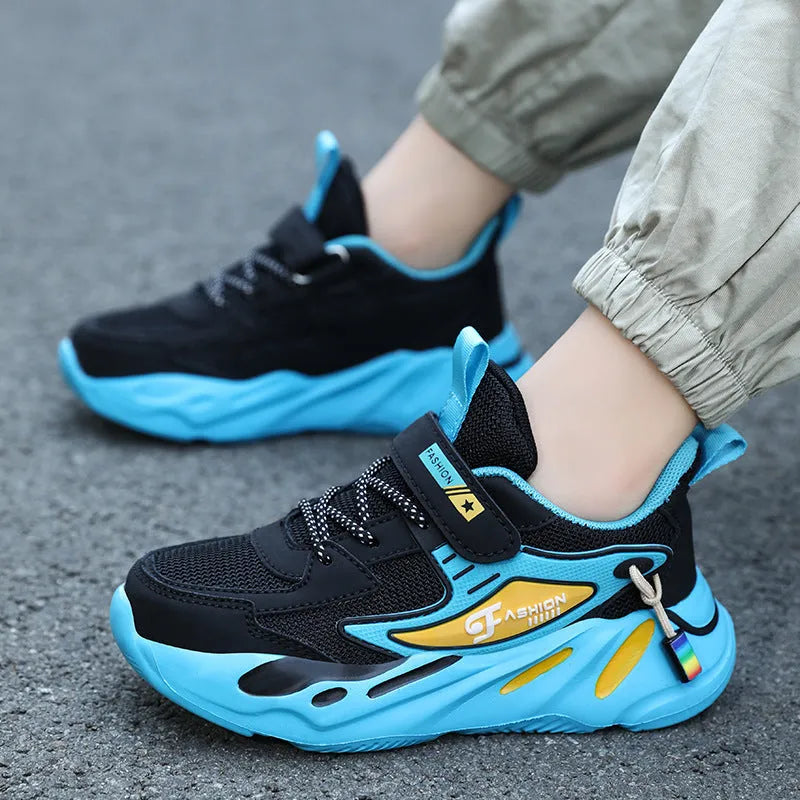 Boys' blue and black Velcro fastening sports shoes with a textured non-slip sole.