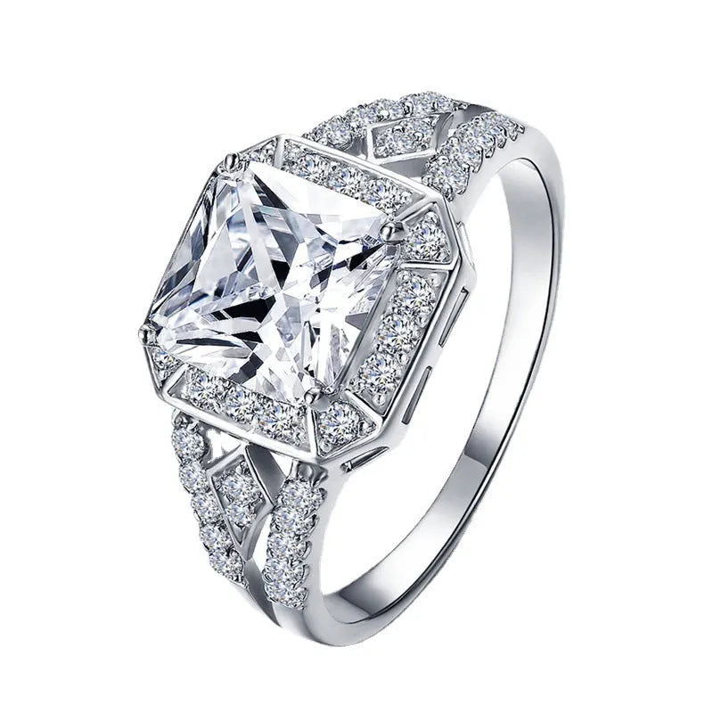 Platinum colour geometric zircon ring with hollow quadrilateral design on finger