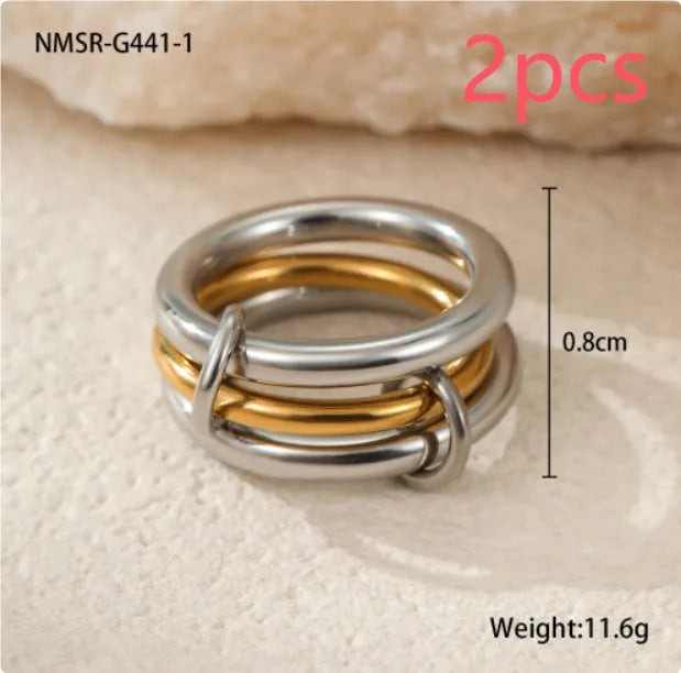 Stacked colour matching stainless steel rings with 18K gold plating in three colour variants for women