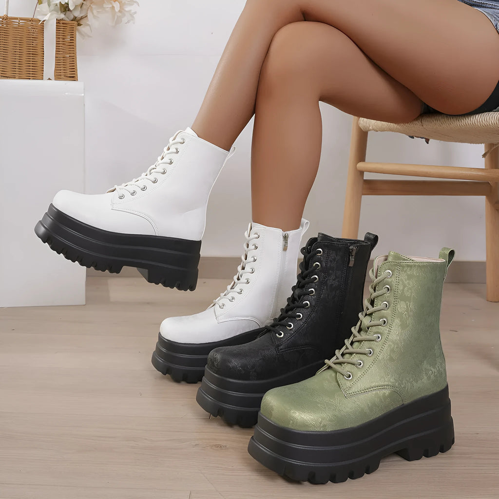 Women's white retro platform boots with patchwork PU upper and chunky rubber sole.
