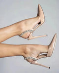 Black patent leather women's high heel sandals with pointed toes and side rhinestone straps.