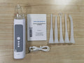 Milky white tonsil stone remover oral cleaning tool with built-in light on a white background.