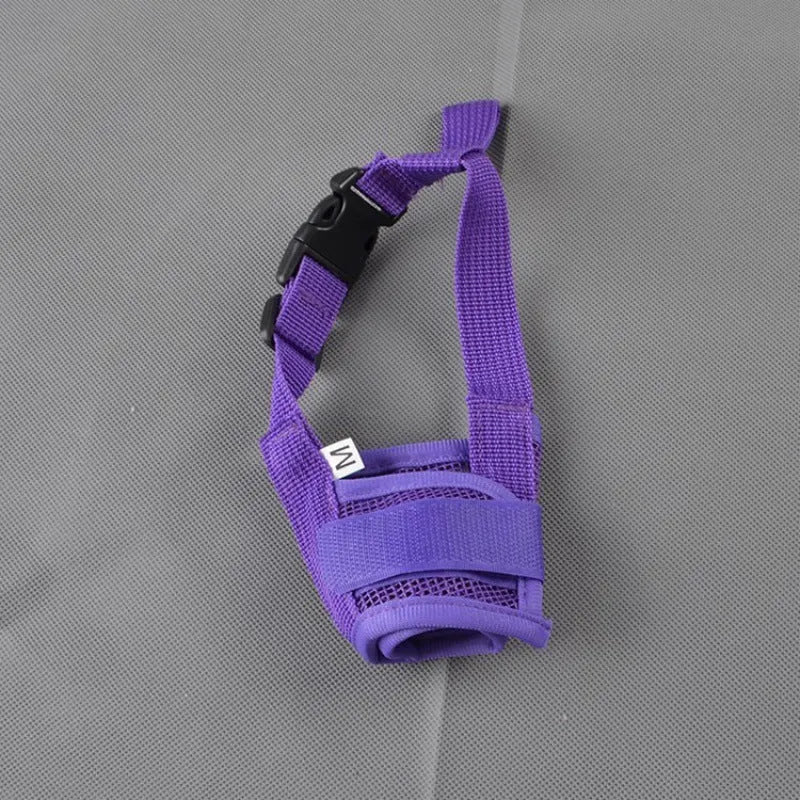 A black adjustable plastic mesh dog muzzle shown on a size chart with options for blue, pink, purple, and red.