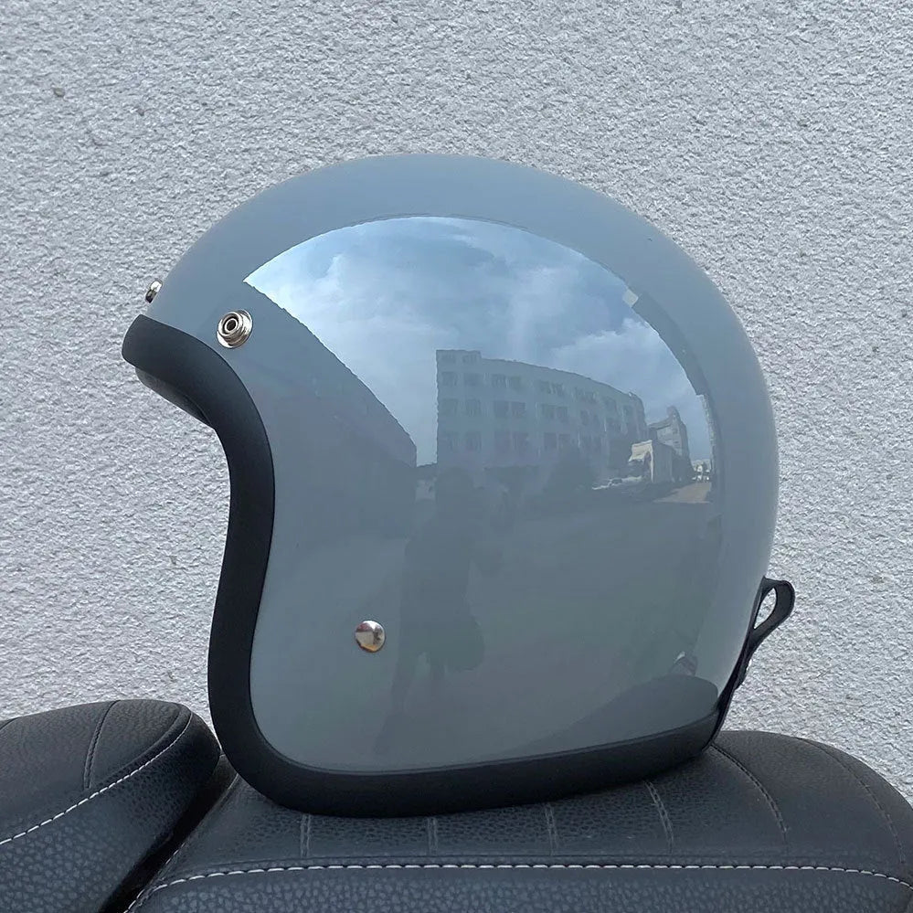Glass fibre motorcycle half helmet shown in a retro style on a stand.